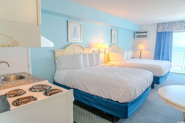 1207 Ocean Blvd S Unit 20802, Myrtle Beach, SC 29577 - bedroom with a sink, a wall mounted air conditioner, and carpet flooring