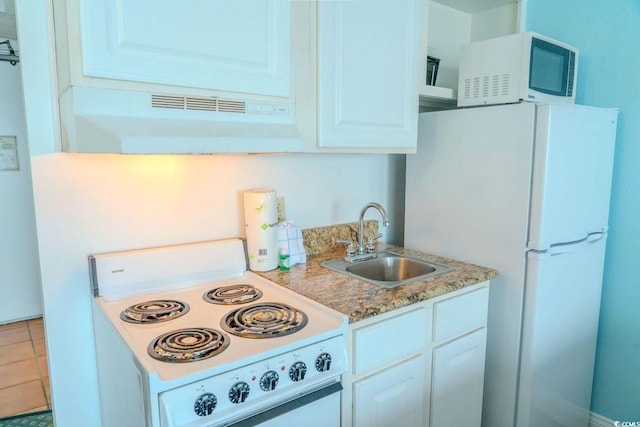 1207 Ocean Blvd S Unit 20802, Myrtle Beach, SC 29577 - kitchen with white appliances, under cabinet range hood, a sink, white cabinets, and light countertops