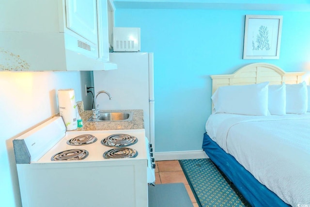 1207 Ocean Blvd S Unit 20802, Myrtle Beach, SC 29577 - bedroom with a sink, baseboards, and light tile patterned floors