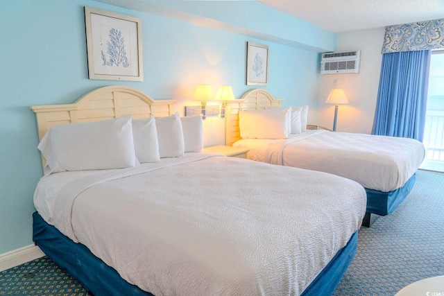 1207 Ocean Blvd S Unit 20802, Myrtle Beach, SC 29577 - bedroom featuring carpet floors, a wall mounted air conditioner, and baseboards