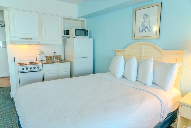 1207 Ocean Blvd S Unit 20802, Myrtle Beach, SC 29577 - bedroom featuring freestanding refrigerator, a sink, and carpet