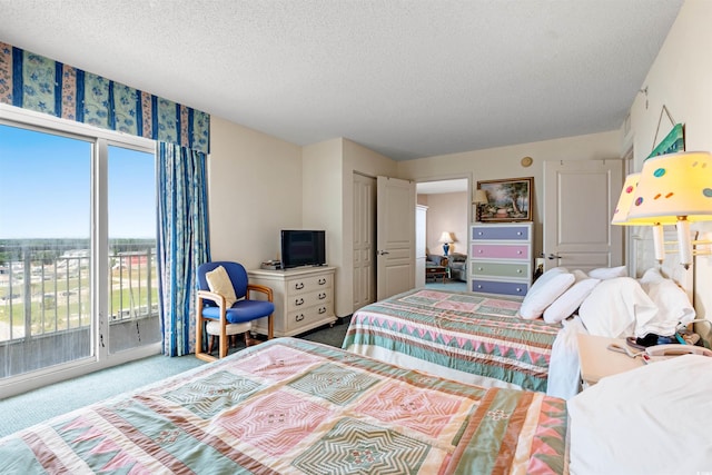 2801 S Ocean Blvd Unit 941, North Myrtle Beach, SC 29582 - carpeted bedroom featuring a textured ceiling and access to outside