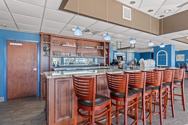 2801 S Ocean Blvd Unit 941, North Myrtle Beach, SC 29582 - indoor dry bar featuring a drop ceiling, dark wood finished floors, and pendant lighting