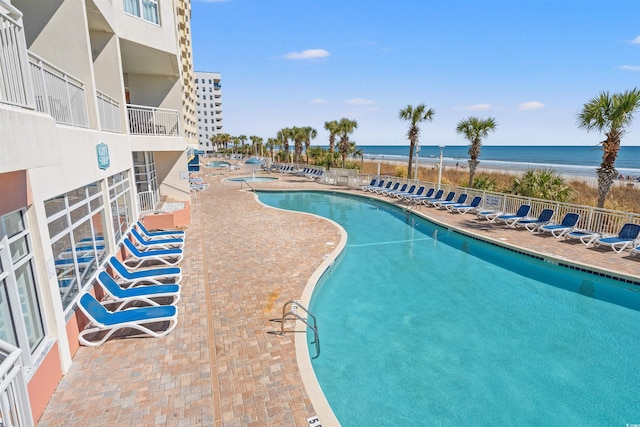 2801 S Ocean Blvd Unit 941, North Myrtle Beach, SC 29582 - community pool featuring a patio area and view of water and beach