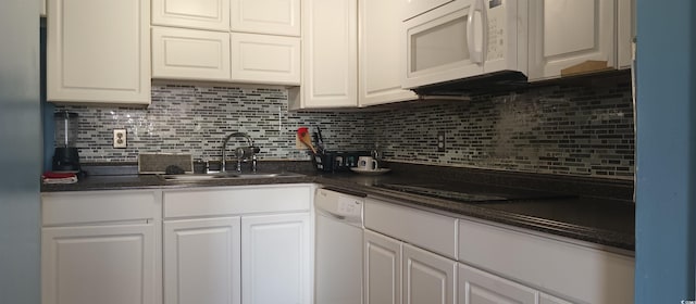 2005 Greens Blvd Unit C-204, Myrtle Beach, SC 29577 - kitchen featuring a sink, white appliances, white cabinetry, and dark countertops
