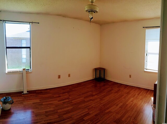 2005 Greens Blvd Unit C-204, Myrtle Beach, SC 29577 - spare room with wood finished floors, a textured ceiling, and baseboards