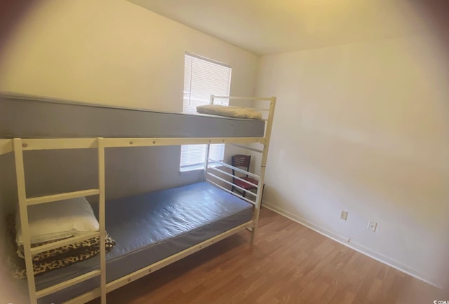 2005 Greens Blvd Unit C-204, Myrtle Beach, SC 29577 - bedroom featuring wood finished floors and baseboards