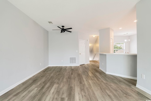 4430-G Montrose Ln Unit G, Myrtle Beach, SC 29579 - unfurnished living room with wood finished floors, baseboards, ceiling fan, and a chandelier