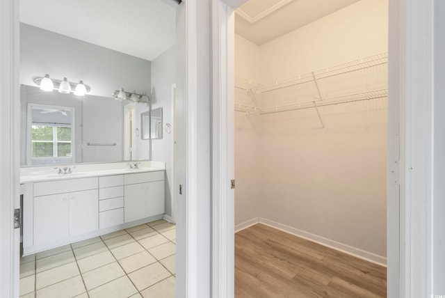 4430-G Montrose Ln Unit G, Myrtle Beach, SC 29579 - full bath with double vanity, a spacious closet, baseboards, and wood finished floors