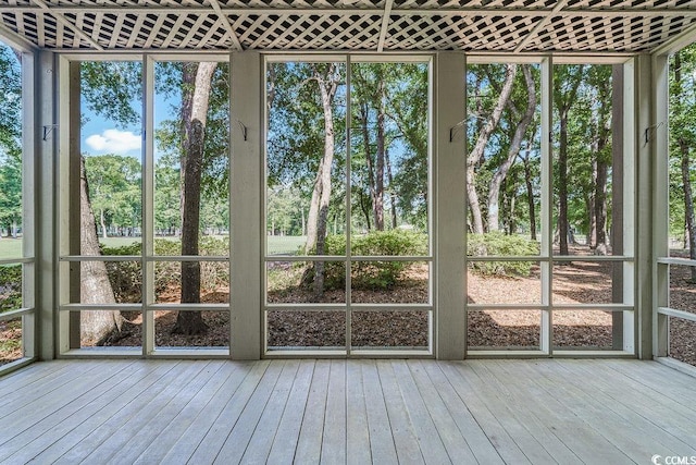 159-1 Weehawka Way Unit 159-1, Pawleys Island, SC 29585 - unfurnished sunroom with view of wooded area