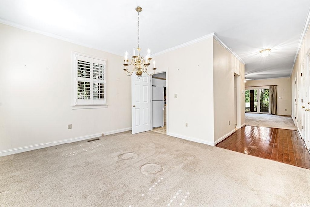 159-1 Weehawka Way Unit 159-1, Pawleys Island, SC 29585 - unfurnished dining area featuring ornamental molding, a chandelier, baseboards, and carpet floors