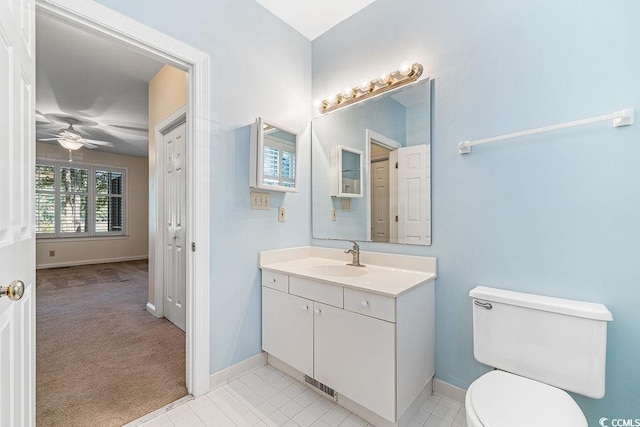159-1 Weehawka Way Unit 159-1, Pawleys Island, SC 29585 - bathroom featuring vanity, toilet, ceiling fan, and baseboards