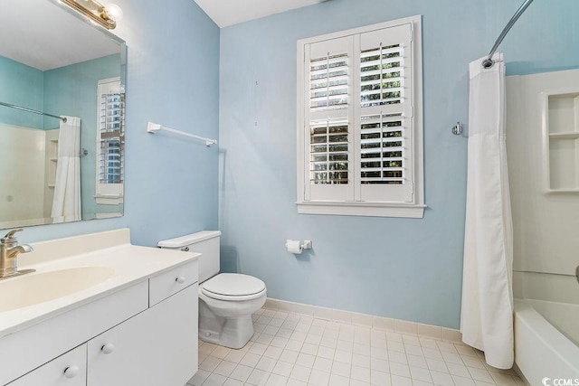 159-1 Weehawka Way Unit 159-1, Pawleys Island, SC 29585 - bathroom featuring vanity, shower / bath combo with shower curtain, tile patterned floors, baseboards, and toilet