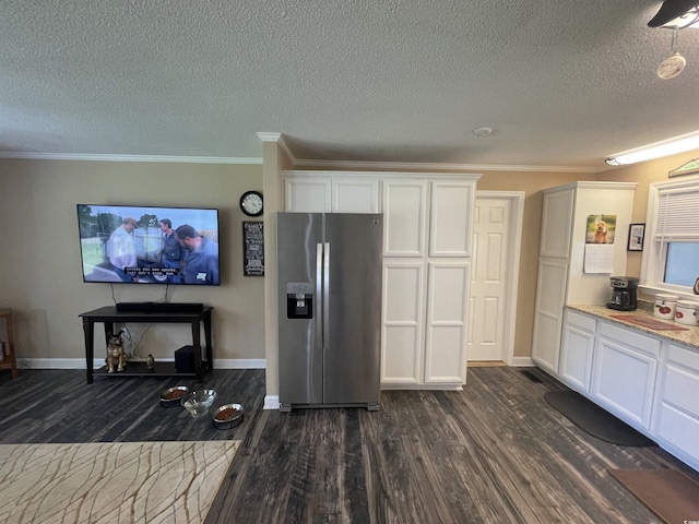 4637 Dogwood St, Loris, SC 29569 - kitchen featuring stainless steel fridge with ice dispenser, dark wood finished floors, white cabinetry, a textured ceiling, and crown molding