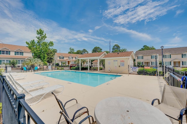 702 Beach Walk Pl Unit 702, Myrtle Beach, SC 29577 - community pool featuring a residential view and a patio area