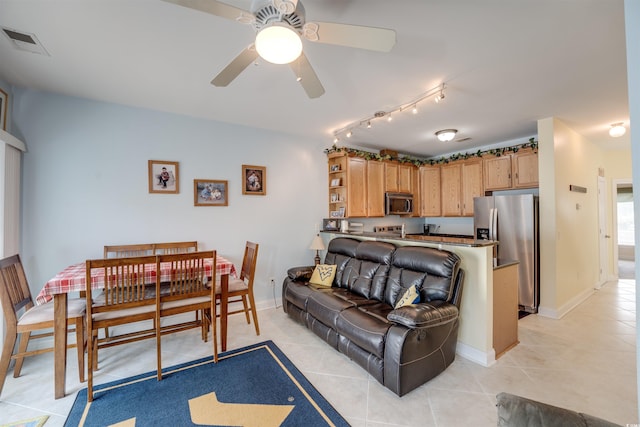 702 Beach Walk Pl Unit 702, Myrtle Beach, SC 29577 - living room featuring light tile patterned flooring, ceiling fan, rail lighting, and baseboards