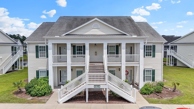4924 Pond Shoals Ct Unit 201, Myrtle Beach, SC 29579 - view of front of house featuring stairs, covered porch, a front lawn, and a shingled roof