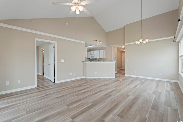 4924 Pond Shoals Ct Unit 201, Myrtle Beach, SC 29579 - unfurnished living room with high vaulted ceiling, ceiling fan, a chandelier, light wood-type flooring, and baseboards