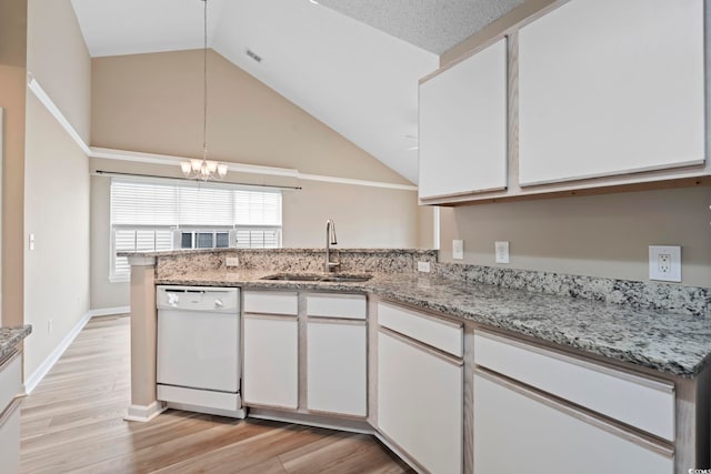 4924 Pond Shoals Ct Unit 201, Myrtle Beach, SC 29579 - kitchen with white dishwasher, a sink, white cabinetry, a chandelier, and a peninsula
