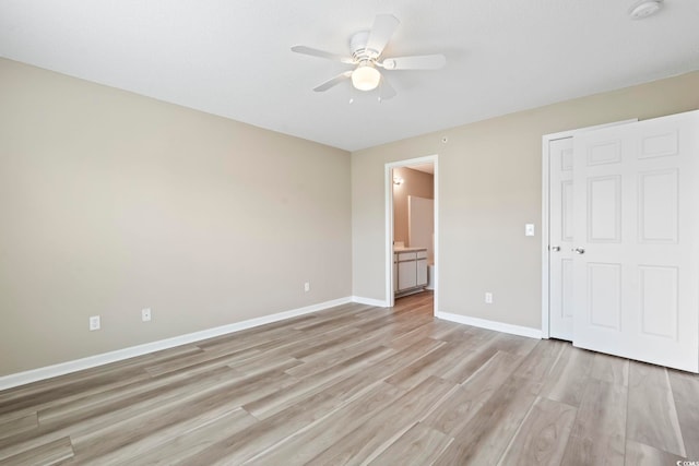 4924 Pond Shoals Ct Unit 201, Myrtle Beach, SC 29579 - unfurnished bedroom featuring light wood-style floors, baseboards, connected bathroom, and ceiling fan