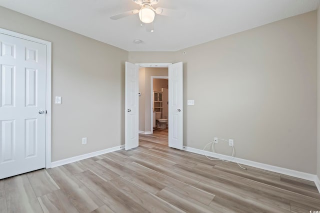 4924 Pond Shoals Ct Unit 201, Myrtle Beach, SC 29579 - unfurnished bedroom featuring light wood-style flooring, baseboards, and a ceiling fan