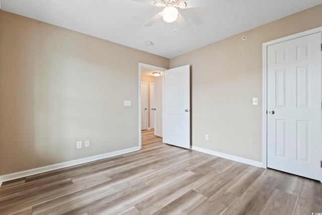 4924 Pond Shoals Ct Unit 201, Myrtle Beach, SC 29579 - unfurnished bedroom with light wood finished floors, baseboards, and a ceiling fan