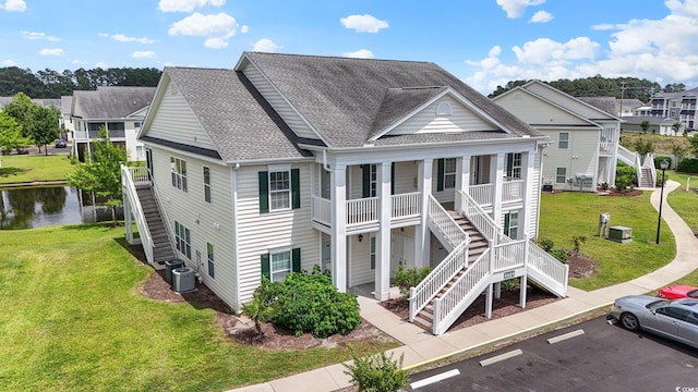 4924 Pond Shoals Ct Unit 201, Myrtle Beach, SC 29579 - view of building exterior featuring stairway, uncovered parking, a water view, a residential view, and central AC