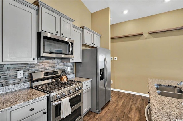 1631 Hepburn Dr, Little River, SC 29566 - kitchen featuring stainless steel appliances, a sink, gray cabinets, tasteful backsplash, and recessed lighting