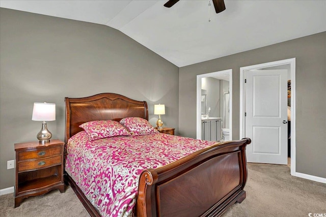 1631 Hepburn Dr, Little River, SC 29566 - bedroom with vaulted ceiling, light carpet, baseboards, ensuite bath, and ceiling fan