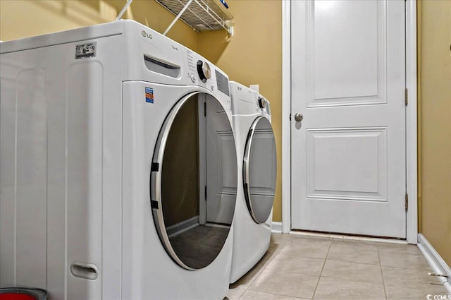 1631 Hepburn Dr, Little River, SC 29566 - washroom with light tile patterned floors, independent washer and dryer, and baseboards
