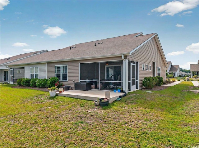 1631 Hepburn Dr, Little River, SC 29566 - back of property featuring a lawn, a sunroom, and a patio area