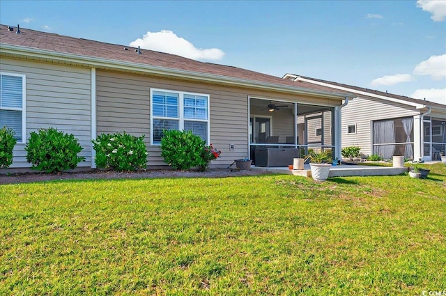 1631 Hepburn Dr, Little River, SC 29566 - back of property with a sunroom, a lawn, and ceiling fan