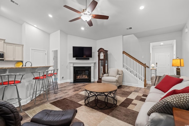 450 Oaklanding Ln, Murrells Inlet, SC 29576 - living room featuring wood finished floors, ceiling fan, stairs, recessed lighting, and baseboards