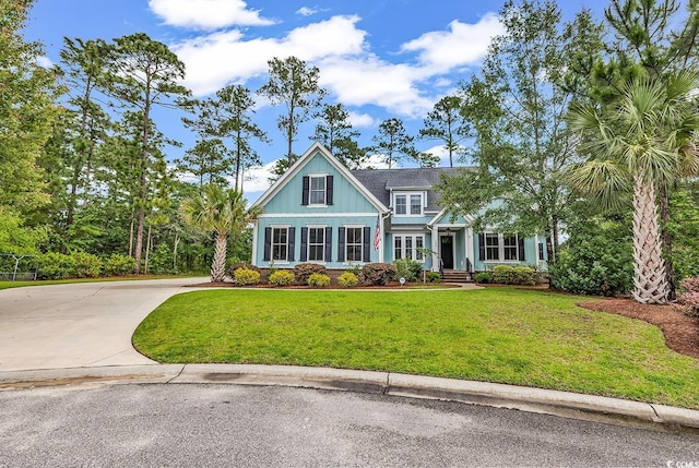 103 Pigeon Forge Ct, Murrells Inlet, SC 29576 - craftsman-style house with a front yard and driveway