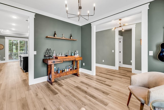 103 Pigeon Forge Ct, Murrells Inlet, SC 29576 - bar area featuring a chandelier, ornamental molding, and light wood-style flooring