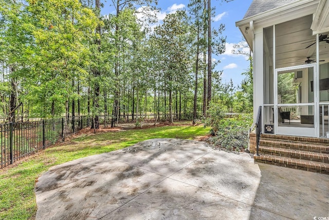 103 Pigeon Forge Ct, Murrells Inlet, SC 29576 - fenced backyard featuring ceiling fan, a patio area, entry steps, and a sunroom