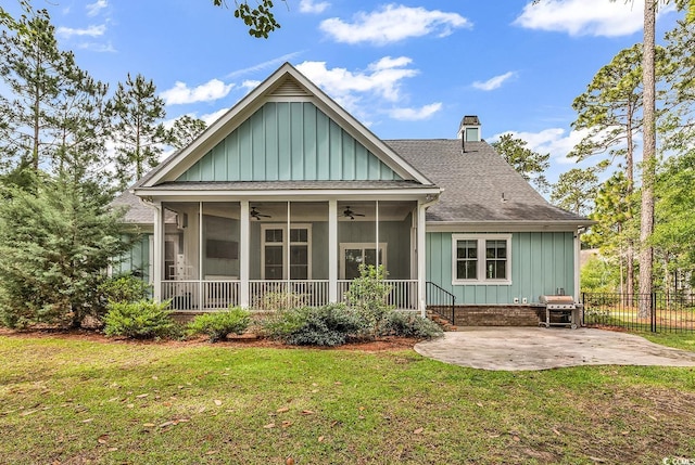 103 Pigeon Forge Ct, Murrells Inlet, SC 29576 - back of property featuring a ceiling fan, a sunroom, board and batten siding, and a shingled roof