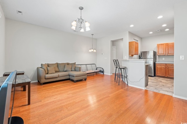 314 Kiskadee Loop Unit 8-C, Conway, SC 29526 - living room featuring a chandelier, light wood-style floors, and recessed lighting