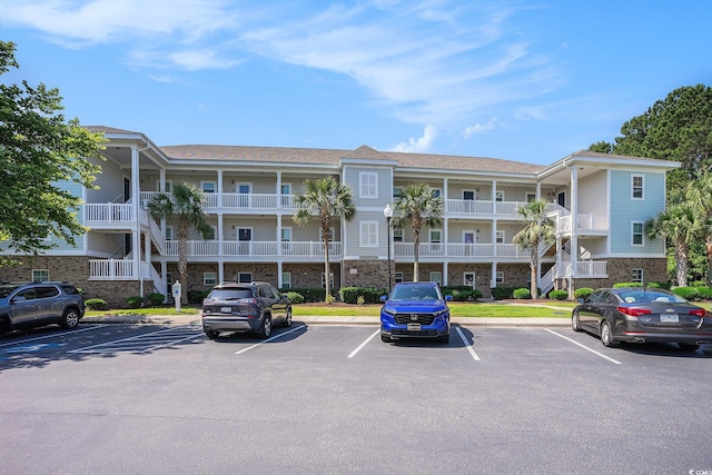 6253 Catalina Dr Unit 1523, North Myrtle Beach, SC 29582 - view of apartment building / complex featuring uncovered parking