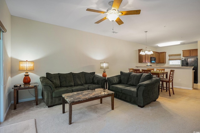 6253 Catalina Dr Unit 1523, North Myrtle Beach, SC 29582 - living area featuring light colored carpet, a ceiling fan, a chandelier, and baseboards