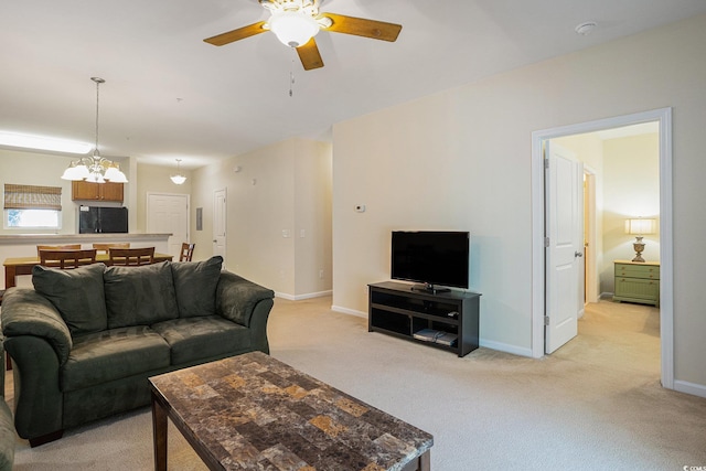 6253 Catalina Dr Unit 1523, North Myrtle Beach, SC 29582 - living room featuring light carpet, a chandelier, ceiling fan, and baseboards