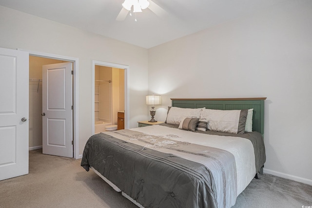 6253 Catalina Dr Unit 1523, North Myrtle Beach, SC 29582 - bedroom featuring light carpet, baseboards, ensuite bath, and ceiling fan