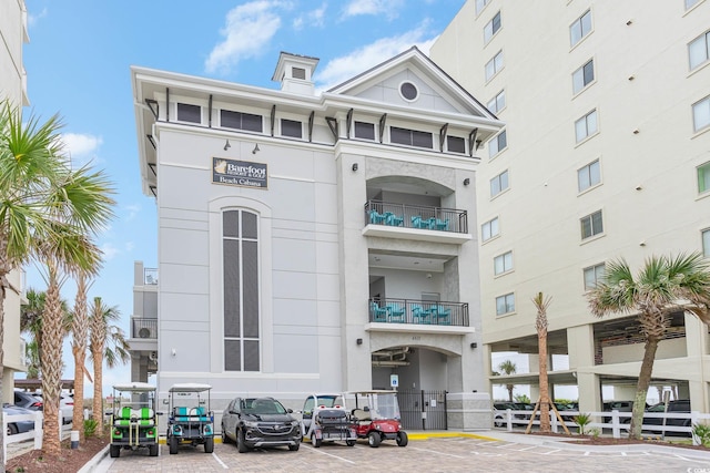 6253 Catalina Dr Unit 1523, North Myrtle Beach, SC 29582 - view of building exterior featuring uncovered parking