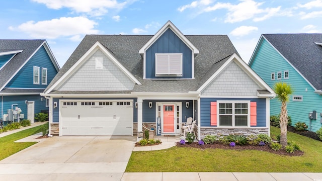 1008 Mary Read Dr, North Myrtle Beach, SC 29582 - craftsman inspired home featuring stone siding, driveway, a front lawn, and an attached garage