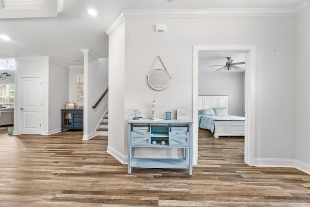 1008 Mary Read Dr, North Myrtle Beach, SC 29582 - hall with wood finished floors, baseboards, ornamental molding, stairway, and recessed lighting