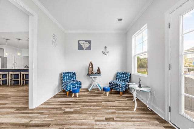 1008 Mary Read Dr, North Myrtle Beach, SC 29582 - living area with wood finished floors, ornamental molding, and baseboards