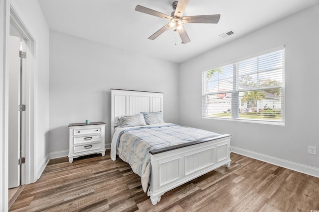 1008 Mary Read Dr, North Myrtle Beach, SC 29582 - bedroom with wood finished floors, baseboards, and a ceiling fan