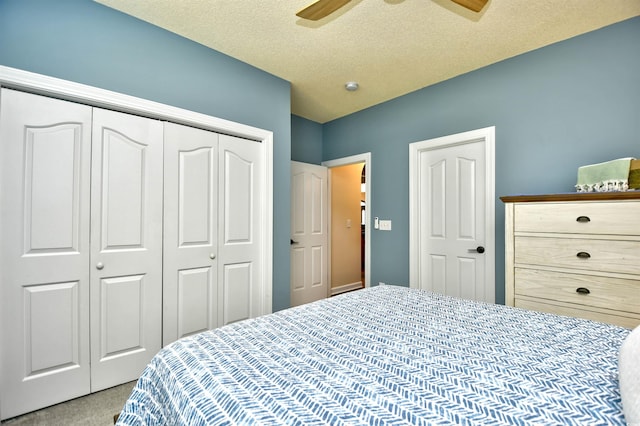 5718 Herring Gull Cir N, Myrtle Beach, SC 29582 - carpeted bedroom with a closet, a textured ceiling, and a ceiling fan