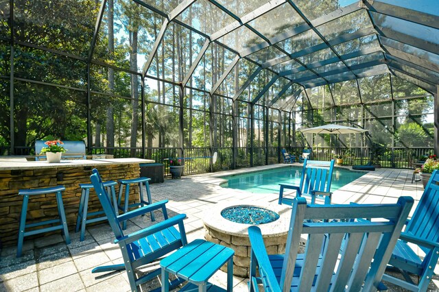 5718 Herring Gull Cir N, Myrtle Beach, SC 29582 - view of pool featuring a fire pit, a patio, and a lanai