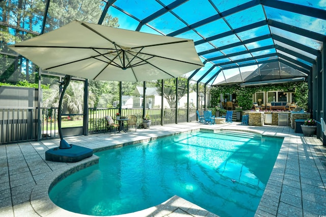 5718 Herring Gull Cir N, Myrtle Beach, SC 29582 - view of pool featuring a patio, glass enclosure, and an outdoor kitchen